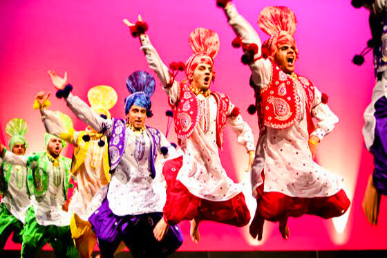 Professional dancers performing on stage in Delhi